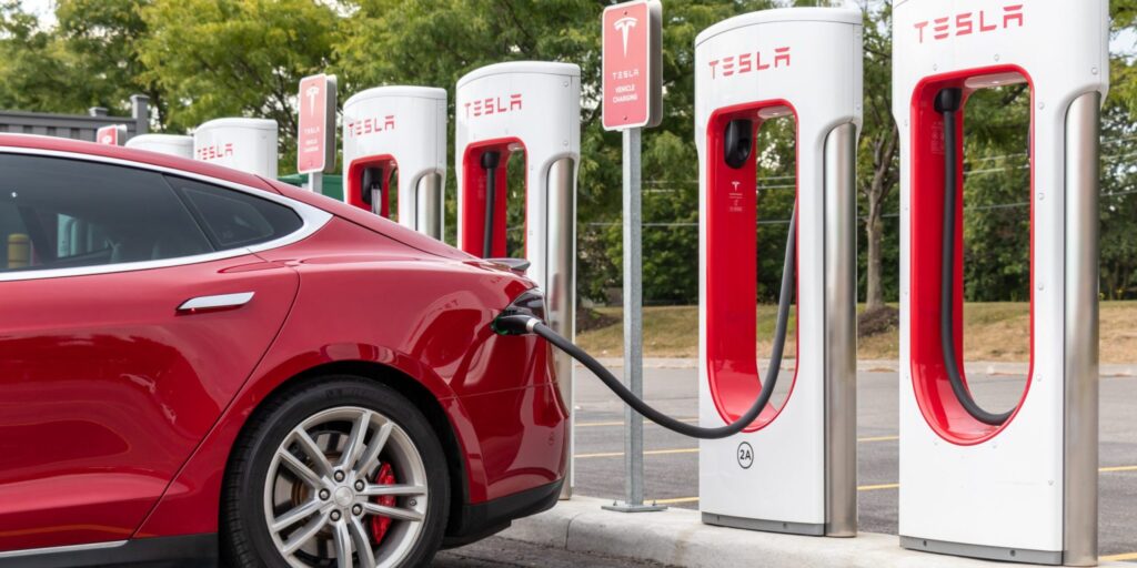 gerry recharging his model 3 Tesla car at 345 speers rd in oakville